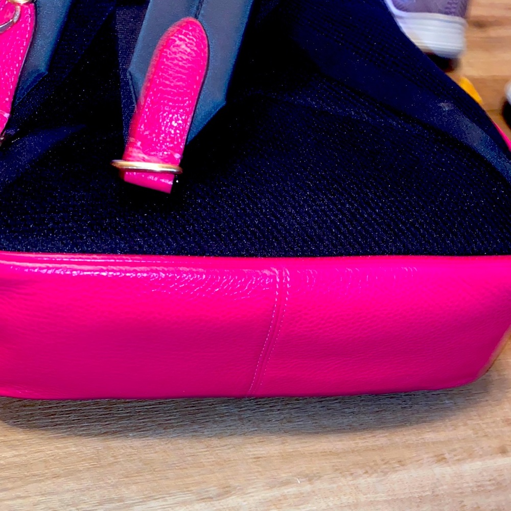 Coach pink backpack. I bought for plane rides, lol. It holds so much stuff.